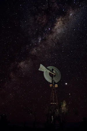 Starry Night Over A Tech Tower Wallpaper