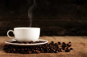 Steaming Coffee Cupand Beans.jpg Wallpaper