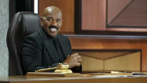 Steve Harvey Portraying Authority In A Classy Black Suit Wallpaper