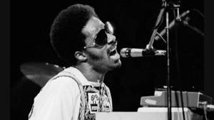 Stevie Wonder Singing Passionately Wallpaper