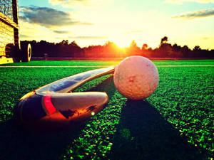Stick And Ball Field Hockey Wallpaper