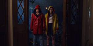 Stranger Things Cast Eleven And Max Raincoats Wallpaper