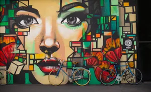 Street Graffiti Of A Bold, Powerful Woman Wallpaper