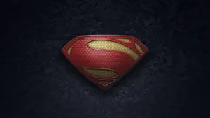 Striking Textured Superman Logo In Red And Yellow Wallpaper