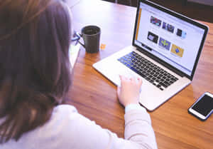 Student Studying With Laptop Wallpaper