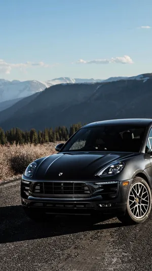 Stunning Black Porsche On City Street Wallpaper