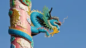 Stunning Blue Dragon In Flight Wallpaper