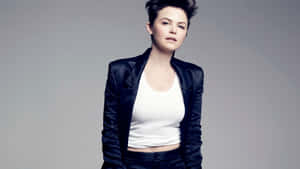 Stunning Ginnifer Goodwin Posing Against A Blue Background Wallpaper