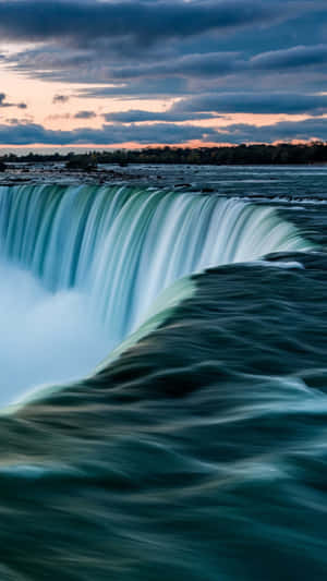Stunning Iphone Wallpaper Of A Majestic Waterfall Wallpaper