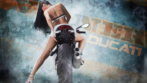 Stunning Lady Riding A Ducati Motorbike Wallpaper