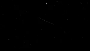 Stunning Meteor Shower In Night Sky Wallpaper