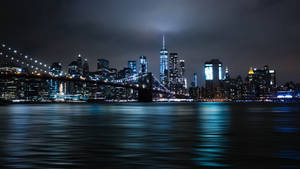 Stunning New York Cityscape Covered In Illuminating Blue Night Lights Wallpaper