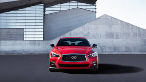 Stunning Red Infiniti Q50 On The Road Wallpaper