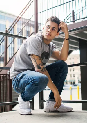 Stylish Skater Guy Embracing The Outdoor Life Wallpaper