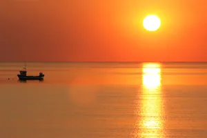 Sun Setting Over Horizon Wallpaper