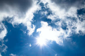 Sunburst Through Clouds Wallpaper