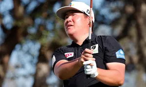 Sungjae Im Holding A Golf Club Wallpaper