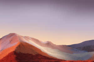 Sunset Glowon Snowy Mountains Wallpaper