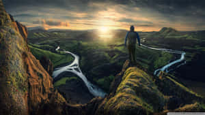 Sunset_ Hiker_ Overlooking_ River_ Valley Wallpaper