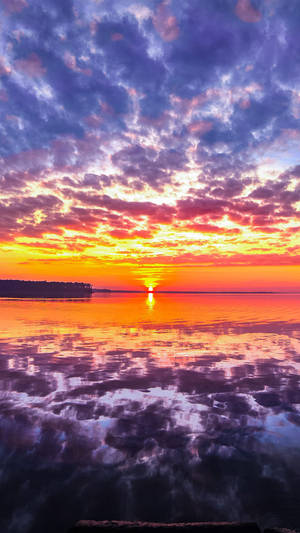 Sunset Ocean With Cloudy Sky Wallpaper