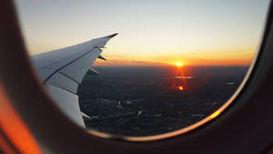 Sunset Window Airplane 4k Wallpaper