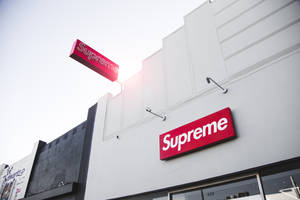 Supreme Skateboarder Making An Impressive Jump Wallpaper