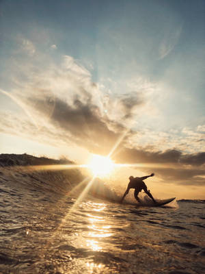 Surfing A Beach Wave Iphone Wallpaper