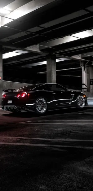 Take The Excitement Of The Nissan Skyline On The Road With The Iphone 8 Wallpaper