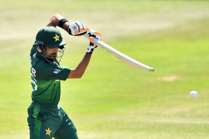Talented Cricketer Babar Azam In Action Wallpaper