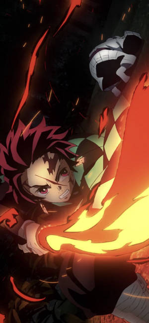 Tanjiro Unleashes His Fire Breathing Technique Wallpaper