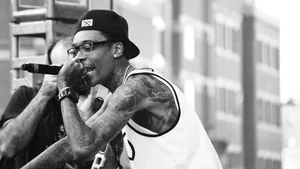 Tattooed_ Performer_in_ Concert_ B W Wallpaper
