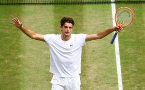 Taylor Fritz Dominating The Tennis Court Wallpaper