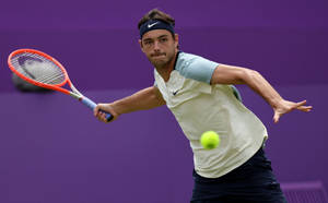 Taylor Fritz Intently Focused On His Tennis Match Wallpaper