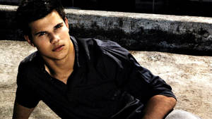 Taylor Lautner On The Floor Wallpaper