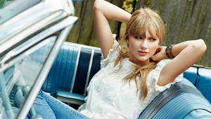 Taylor Swift Sits Comfortably In Car Wallpaper