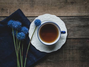 Tea And Navy Blue Flowers Wallpaper