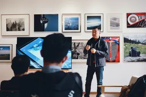 Teacher Presenting Digital Art To Millennials Wallpaper