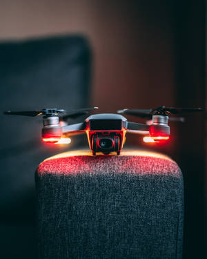Technology Drone On Armchair Wallpaper