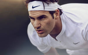 Tennis Maestro Roger Federer In Action Wallpaper