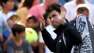 Tennis Player Dominic Thiem Applauding Crowd Wallpaper