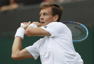 Tennis Pro Tomas Berdych In Action Wallpaper