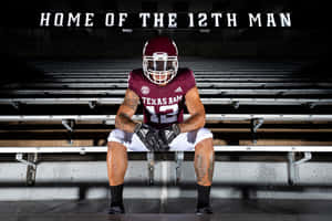 Texas Am Man In A Football Uniform Sitting On The Bleachers Wallpaper