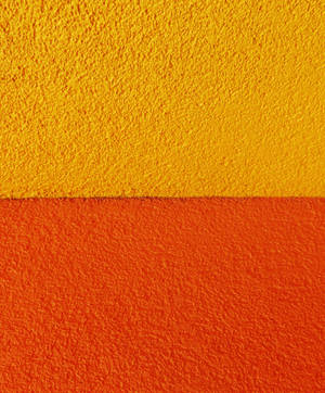 Textured Orange And Yellow Concrete Wallpaper