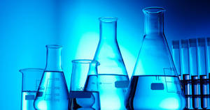 The Beauty Of Chemistry - Minimalist Blue-themed Laboratory Scene. Wallpaper