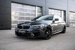 The Bmw M5, A Luxurious High-performance Car. Wallpaper
