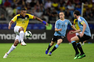 The Ecuador National Football Team In Action Against Argentina Wallpaper