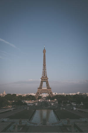 The Eiffel Tower Stands Out In The Classic Skyline Of Paris Wallpaper