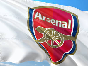 The Emblem Of Pride - The Glorious Arsenal Fc Logo On A White Flag Wallpaper