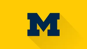The Logo Of Michigan Wolverines Wallpaper