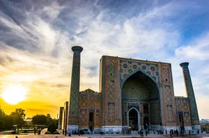 The Majestic Ulugh Beg Madrasah Under The Sunlight In Samarkand Wallpaper